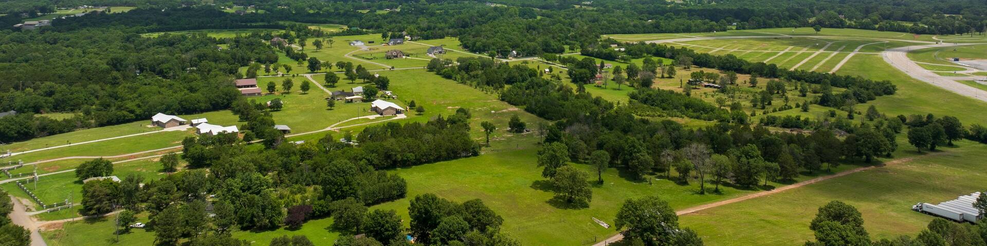 aerial shot of vast miles of lush green trees and homes at the Nashville Superspeedway in Lebanon Tennessee USA