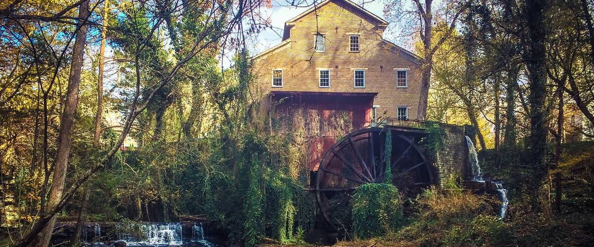 This historic mill was built in 1873 and first used as a cotton & woolen factory, then later converted as a cotton gin and wood working shop. Today the waterwheel powers the millstones that produce stone ground flour, cornmeal and grits. It's listed on the National Register of Historic Places.