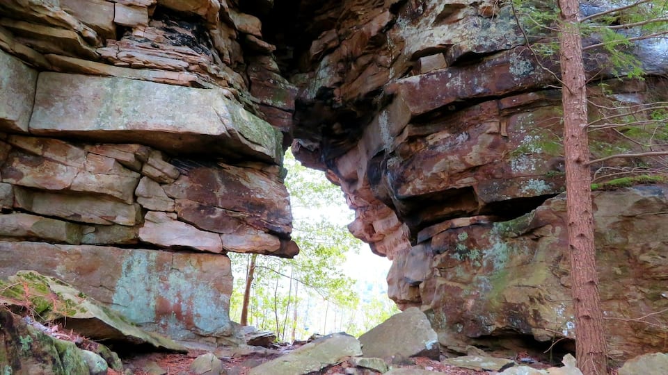 A natural rock formation with a narrow passageway.