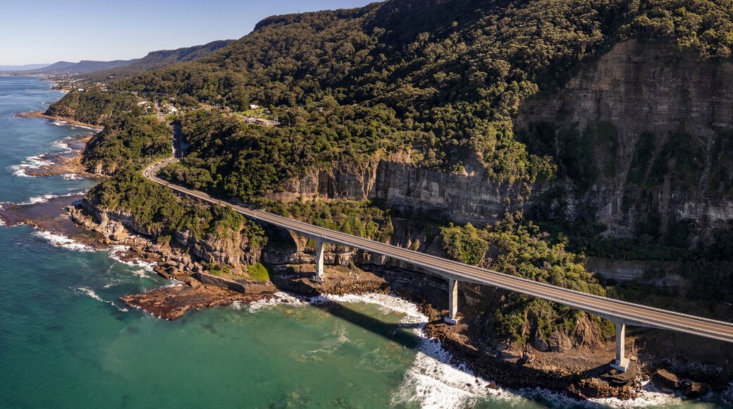 Aerial view of Sea cliff bridge at the edge of steep sandstone cliff on the Grand Pacific drive along pacific coast of Australia, NSW.