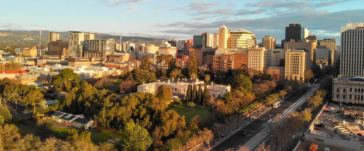 ADELAIDE, AUSTRALIA - SEPTEMBER 16, 2018: Aerial view of city skyline at sunset. Adelaide is the main city of South Australia State