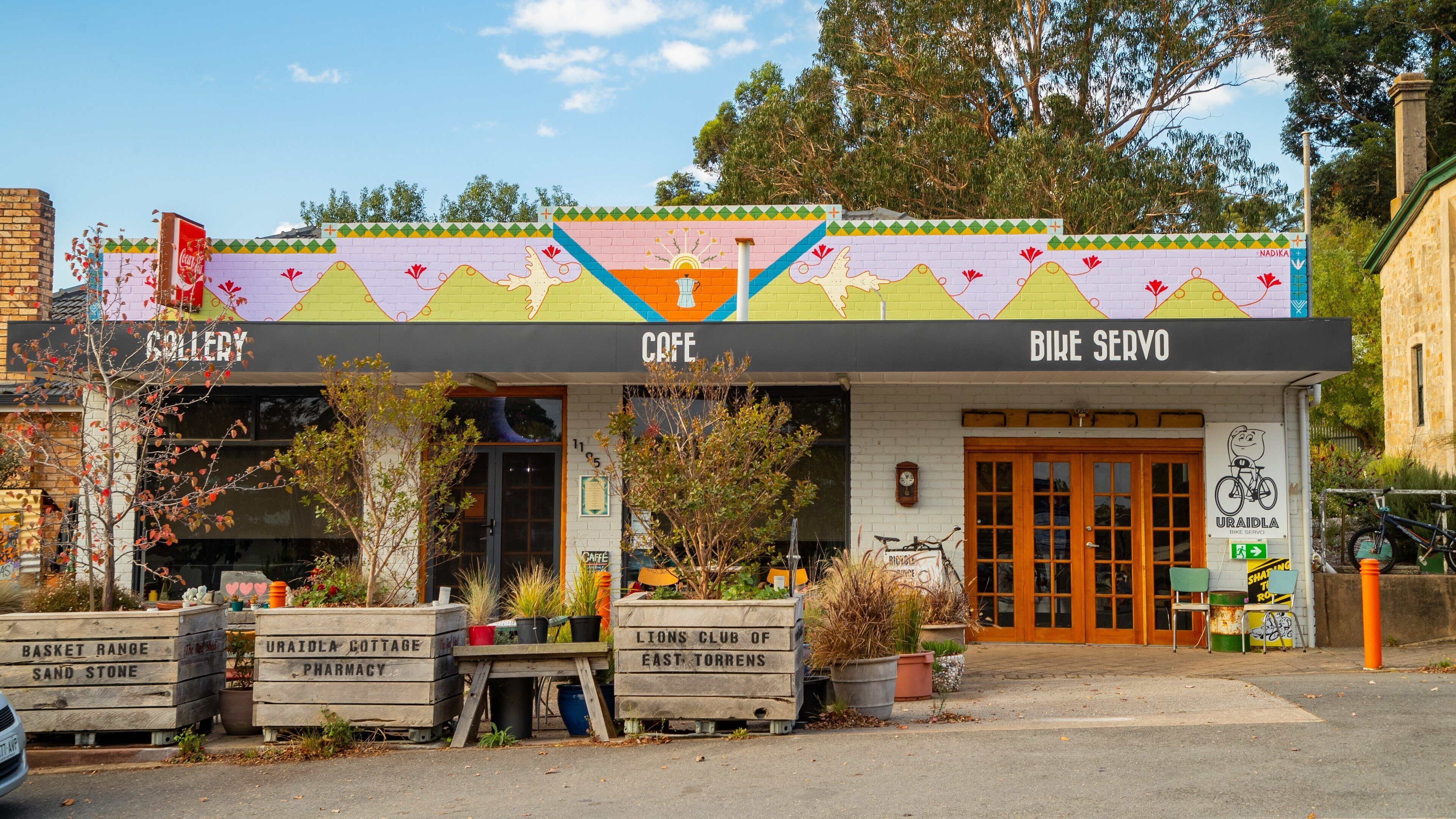 Uraidla which includes a small town or village and signage