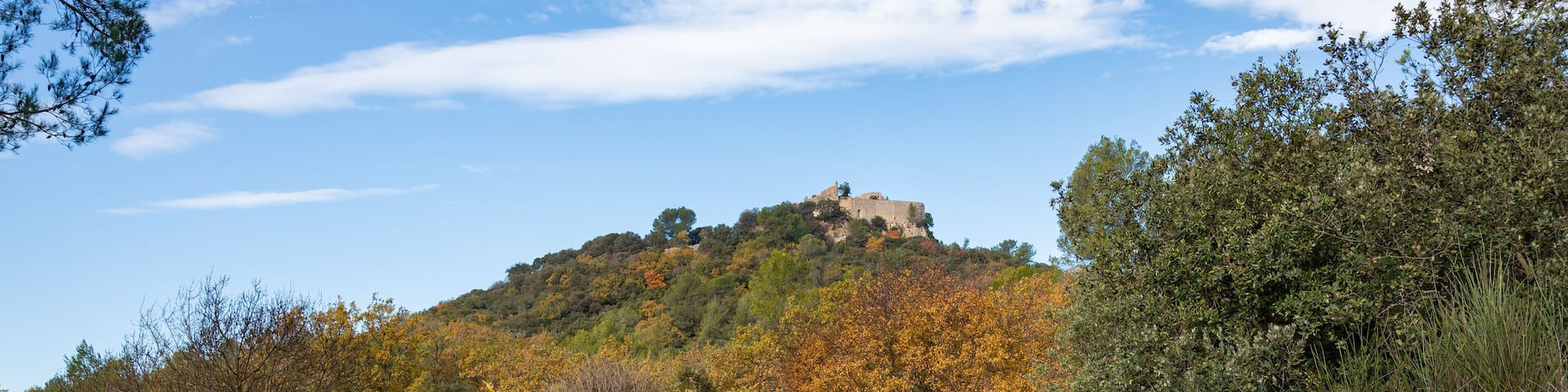 Ruins of the castle of Castellas, over Rocbaron and Forcalquieret in Provence, France, under a nice cloudy sky in winter