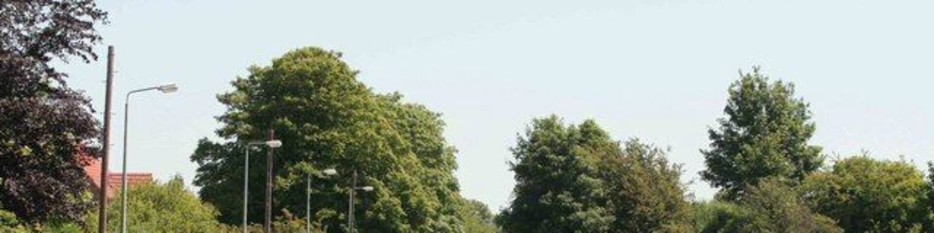 Approach to Graiselound village. Can you spot the railway embankment on the right. Once the railway crossed the road by an overbridge which has been demolished. The railway shut many years ago.