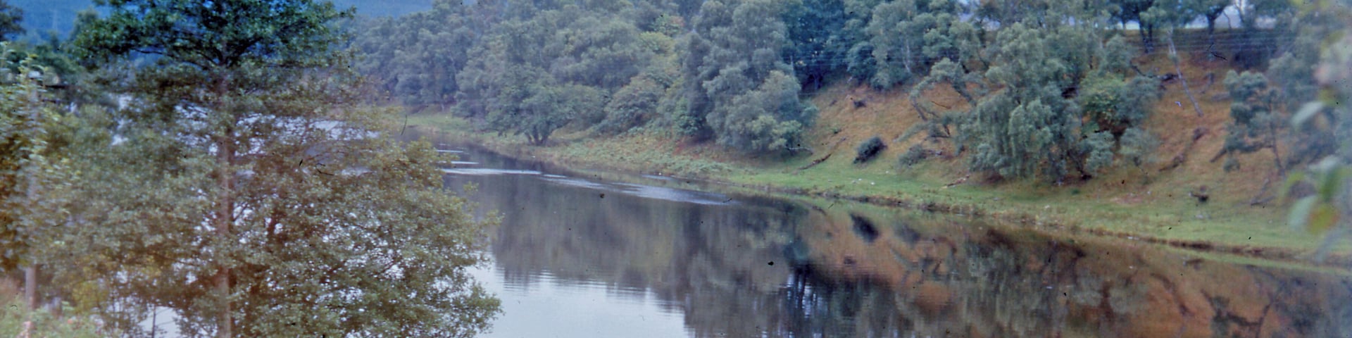 Kyle of Sutherland at Invershin. View SW from A836. The River Shin forms the border between Sutherland and Ross & Cromarty. The railway bridge is behind the camera.