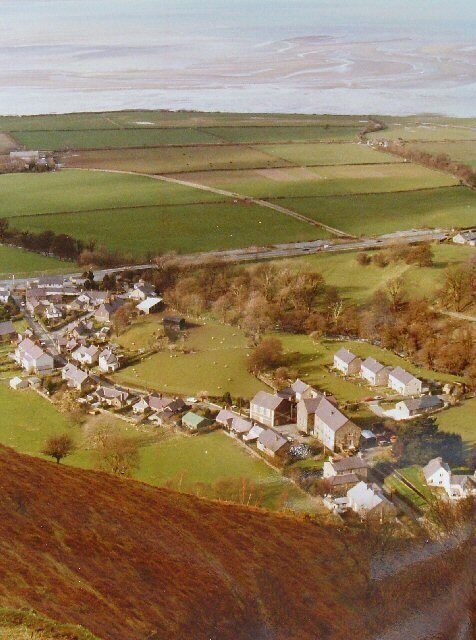 Abergwyngregyn Village. Viewed from the S from the steep ridge running down from Ffridd Ddu. The village below Aber Falls.