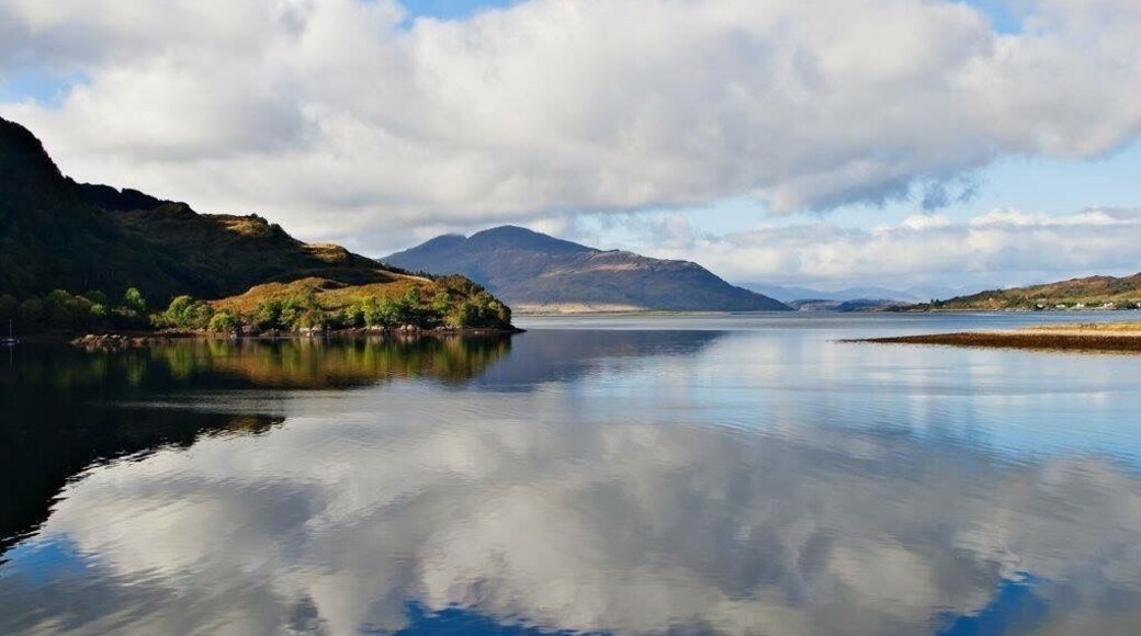 Lake at the Eilean Donan Castle. Partly cloudy reflections at the afternoon.