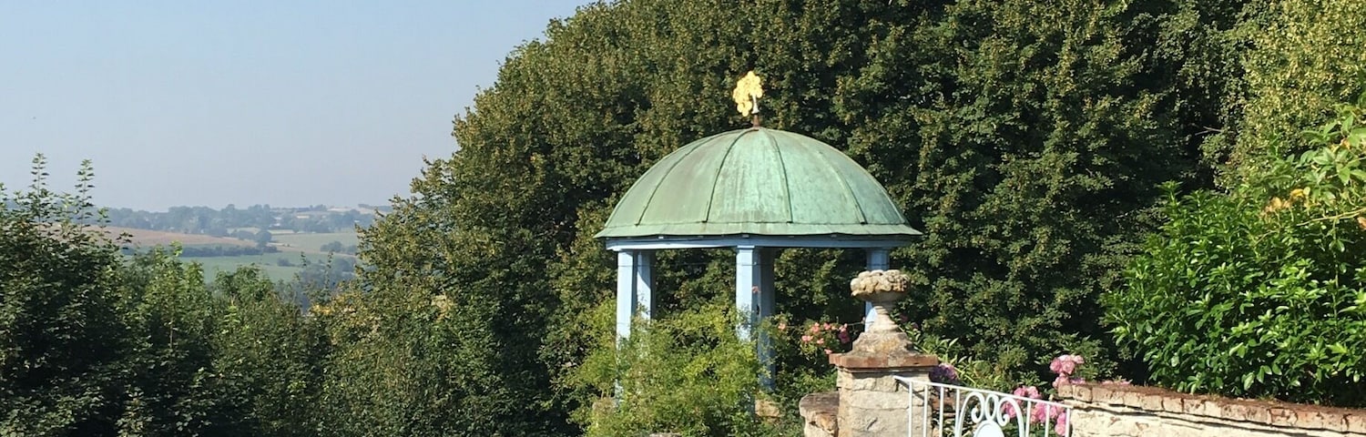 The charming town of Gerberoy in Picardie near the Normandie coast is a quiet, sleepy place that is a joy to walk through. You'll find hidden cafes and numerous rose gardens. The garden in the photo is a must visit for its beautiful landscaping and lovely flowers.