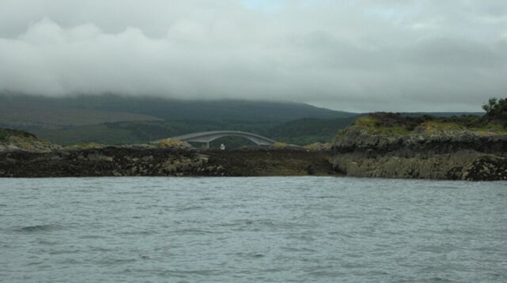 The gap on Eilean a' Mhal The Skye Bridge and Kyleakin Lighthouse, on Eilean Ban, can be seen through the gap on Eilean a' Mhal.