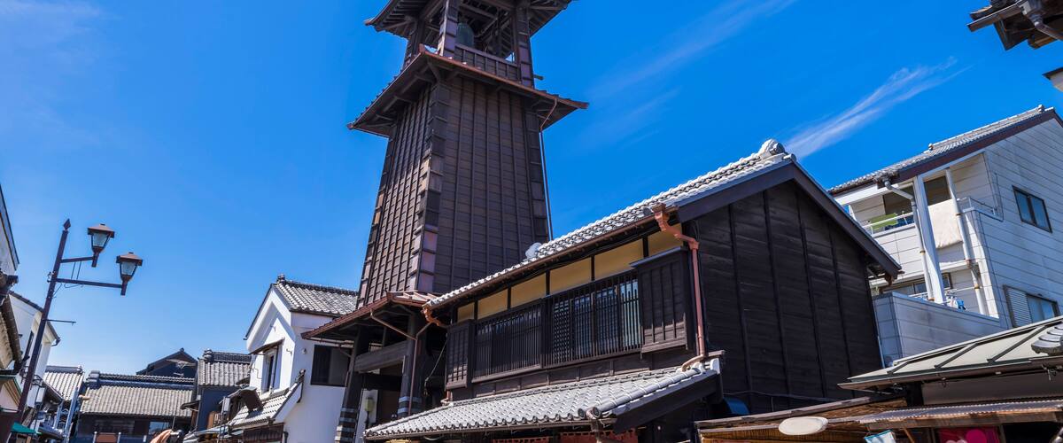 A traditional Japanese building with a wooden structure and tiled roof.