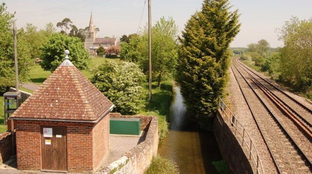Little Bedwyn from the railway footbridge View looks northwards from the top of the railway footbridge. A Thames Water pumping station and the main railway line are in the foreground whilst Little Bedwyn church is almost obscured by the May blossom.