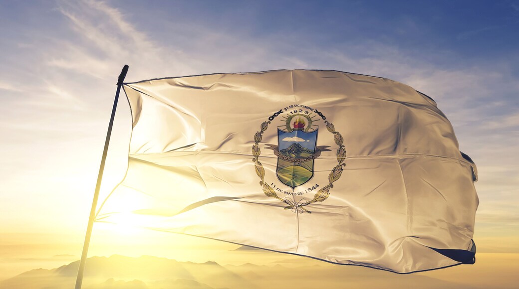 La Paz department of El Salvador flag waving on the top sunrise mist fog