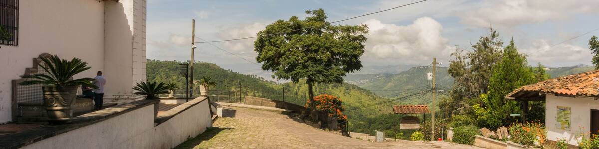 Stone streets with a pretty view and the Santa Lucia church Honduras Central America