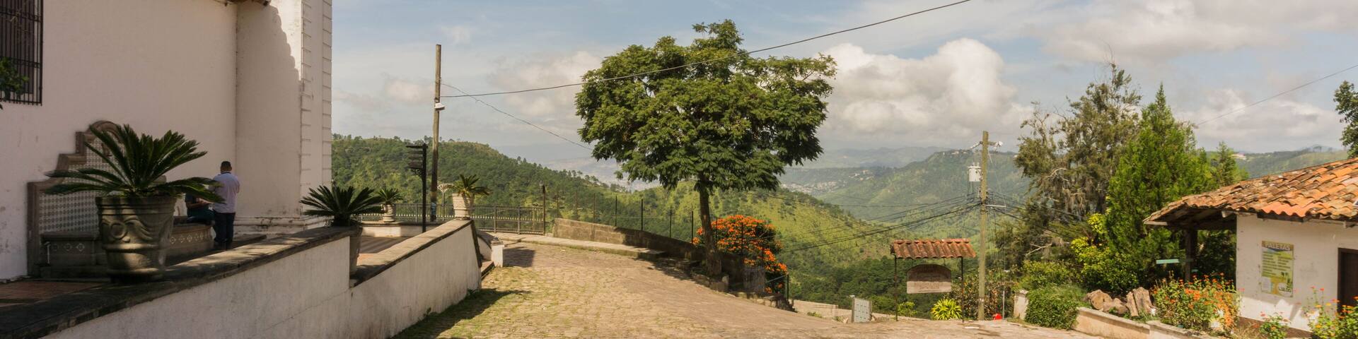 Stone streets with a pretty view and the Santa Lucia church Honduras Central America