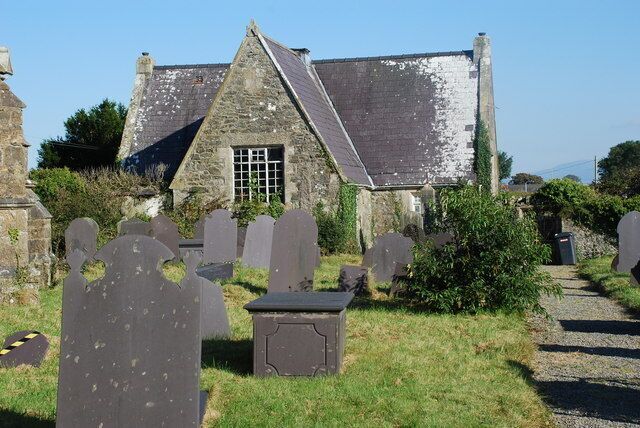 Mynwent Eglwys S Mihangel Gaerwen St Michael's Churchyard. The churchyard of 577862. The derelict buildings lie at the end of the churchyard and to the rear of the new rectory.