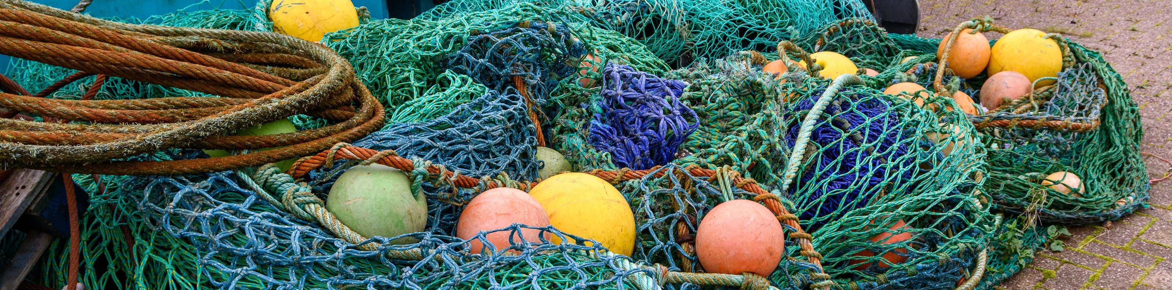 A collection of fishing nets and buoys.