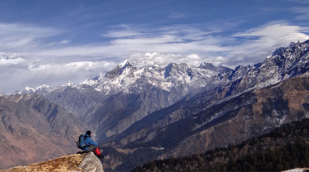 The popular Kauri pass trek is renowned to be known for its scenic meadow and mountain ranges while reaching its summit. One such spot is a hill edge just after a stone shrine where there are prayer flags hanging beside it. One can see the panoramic view of a mountain range as if it’s God’s own Dharma Production film in theatre of nature.