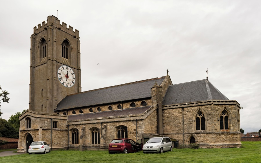 The church dates from the 13th century onwards, the chancel has been rebuilt twice, in 1741 and 1870. There is a western tower with arched openings to north and south allowing pedestrians to pass through, a nave with clerestory, north and south aisles, south porch, and chancel with apse. The tower is of three stages from the 14th century, but the belfry stage is from the 15th century. It is buttressed with embattled parapets. There are six bells. The church is famous for its one-handed clock, which dates from the 17th century. The dial is 16 feet in diameter and believed to be the largest single-handed clock in Europe. The nave arcades have five bays with octagonal piers. The north aisle is from the 14th century, with the south aisle being from the 15th century, both have human head label stops. At the east end of the south aisle is a Lady Chapel. The nave has a 14th century king post roof. The 14th century chancel arch once had a rood loft, and the access doors still remain on the south side. The south porch dates from the 15th century and has a parvis above. The chancel, with polygonal apse, was rebuilt in 1870 by T.C. Hine and Son. The church contains several memorial plaques to members of aircrew from RAF Coningsby killed in flying accidents and WWII.