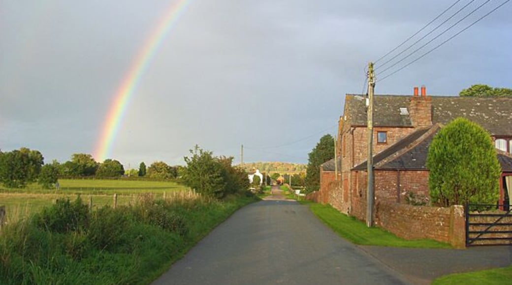 Road and house at Catterlen Just above the junction with the B5305 beyond which further houses can be seen.