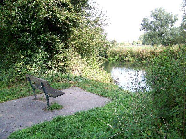 Sit and rest beside the River Wylye A conveniently placed seat beside the river.