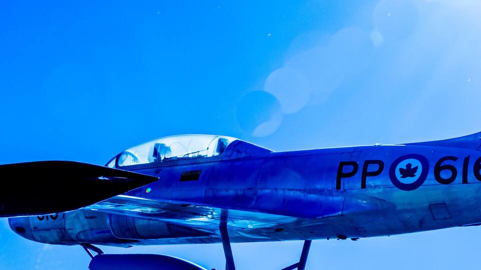 A vintage aircraft with the registration number PP 616 in flight.
