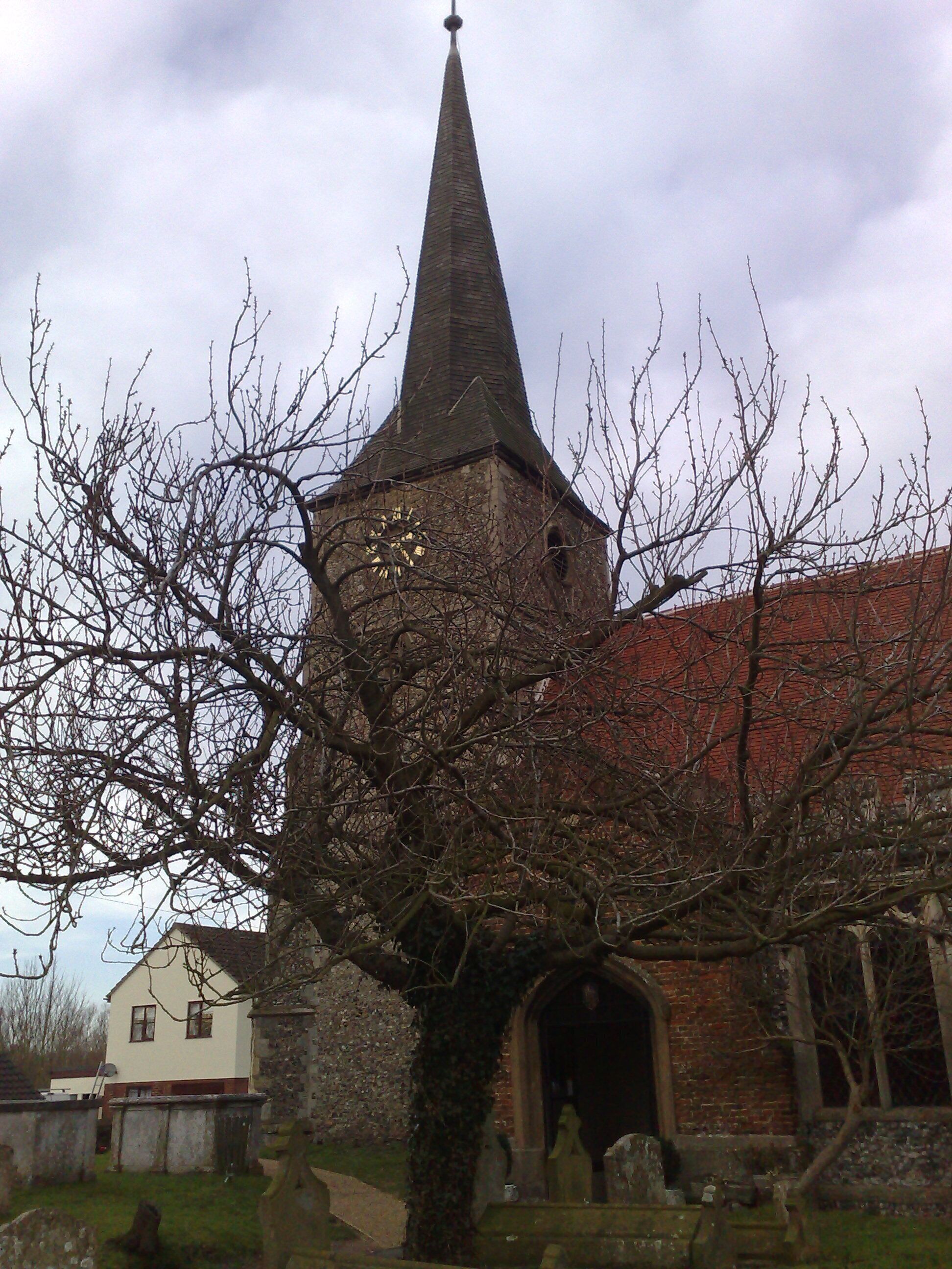 West tower and spire of St Andrew's parish church, Great Cornard, Suffolk, seen from the southeast
