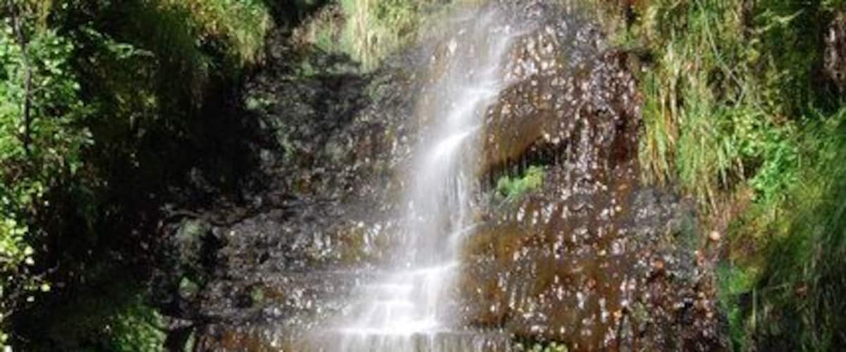 Waterfall on Twrch tributary stream Photograph taken 26/08/07. Late afternoon sun produced this lovely rainbow and highlighted the peat stained plunge pool. Worth a visit.