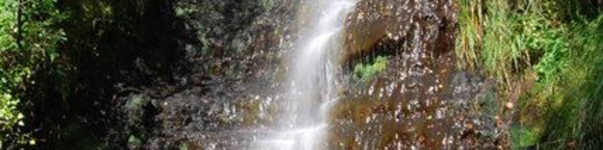 Waterfall on Twrch tributary stream Photograph taken 26/08/07. Late afternoon sun produced this lovely rainbow and highlighted the peat stained plunge pool. Worth a visit.