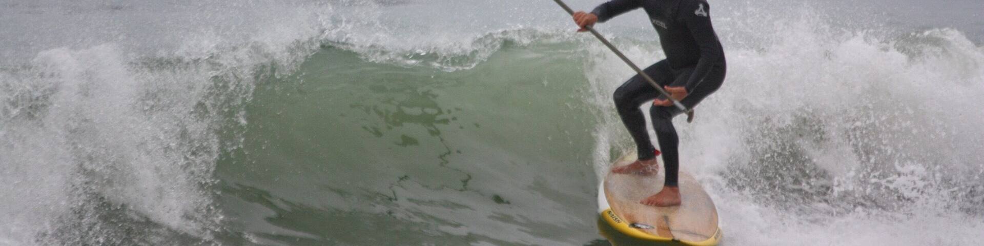 On the beach, stand up paddle .