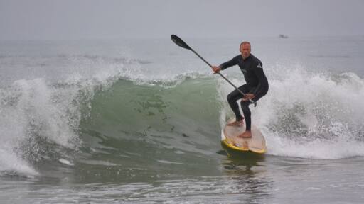 On the beach, stand up paddle .