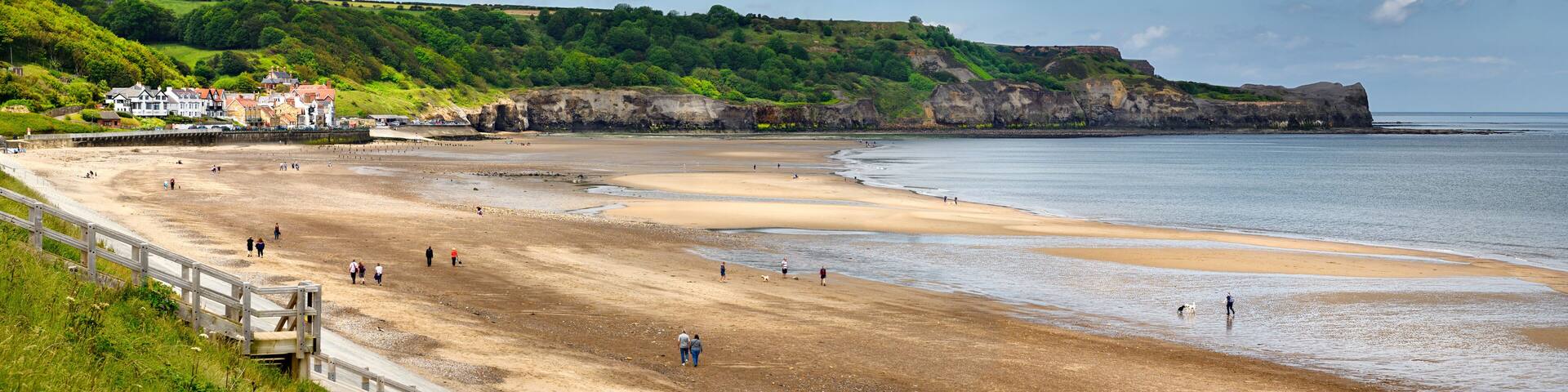 Panorama of Sandsend fishing village and dog friendly Sandsend beach on the North Sea North York Moors National Park England