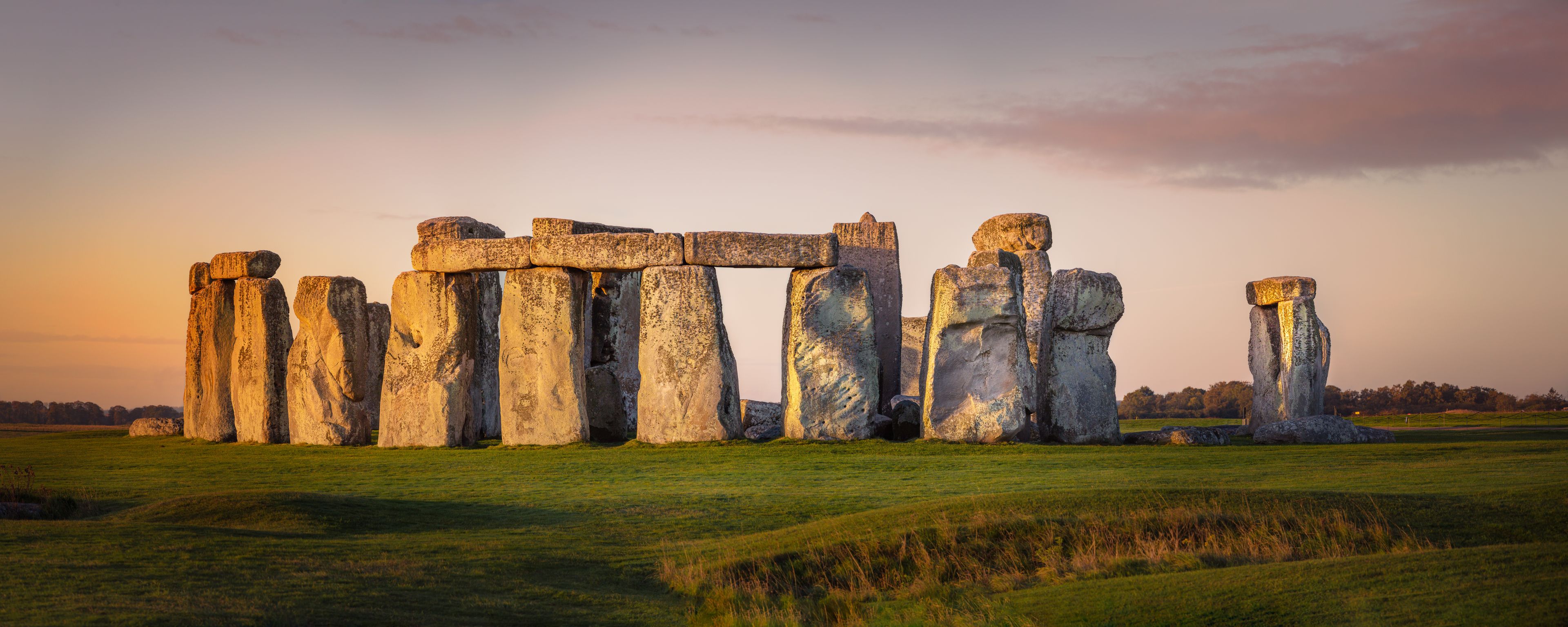 Panorama of the prehistoric site of Stonehenge during early morning. beautiful orange glow on the stones