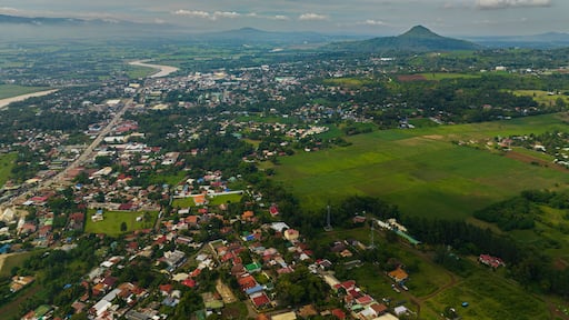 Tropical mountain with river and city with houses and river. Bukidnon, Philippines. Mindanao.