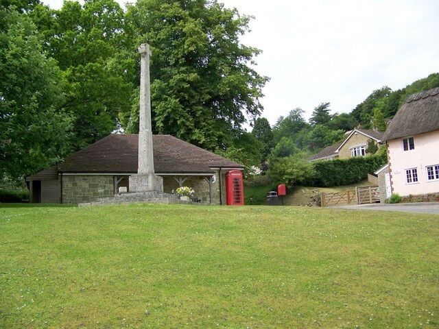 Village green, East Knoyle A K6 type telephone box set against Wren's Store with the village war memorial.