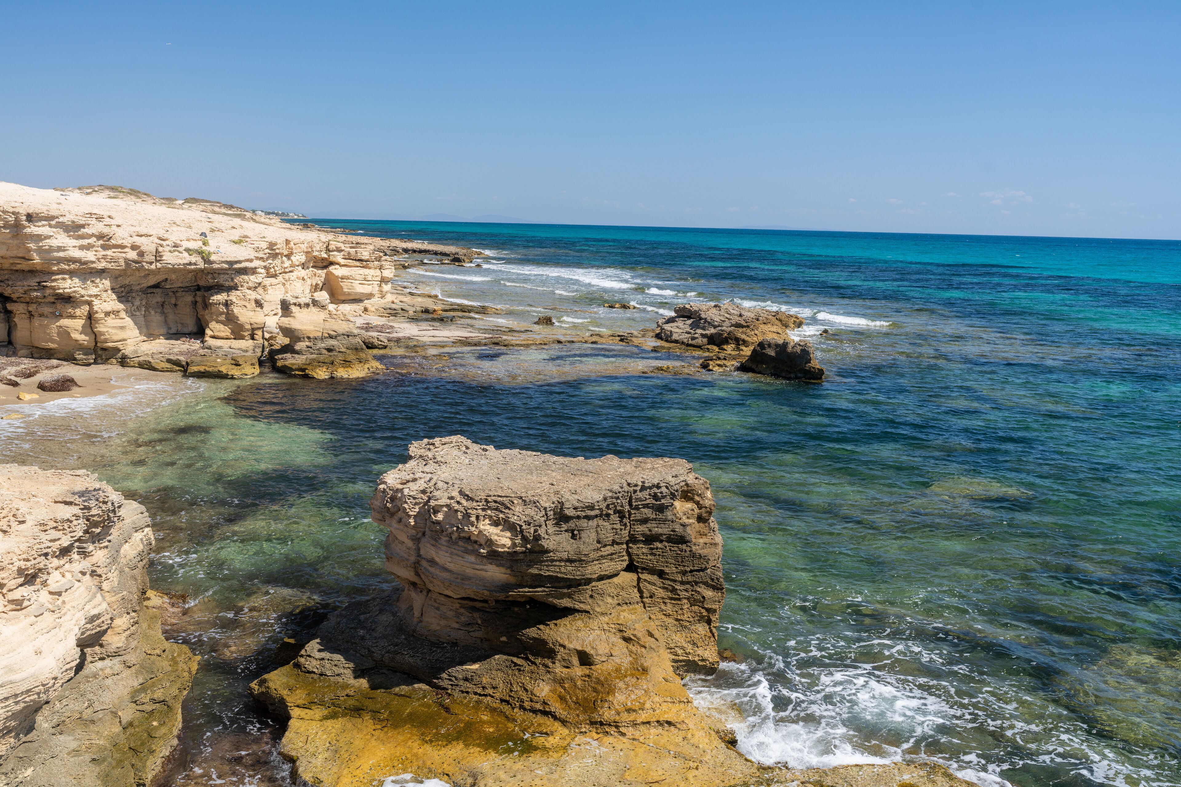 Rocky Shoreline and Turquoise Waters on Hergla Coast, Tunisia