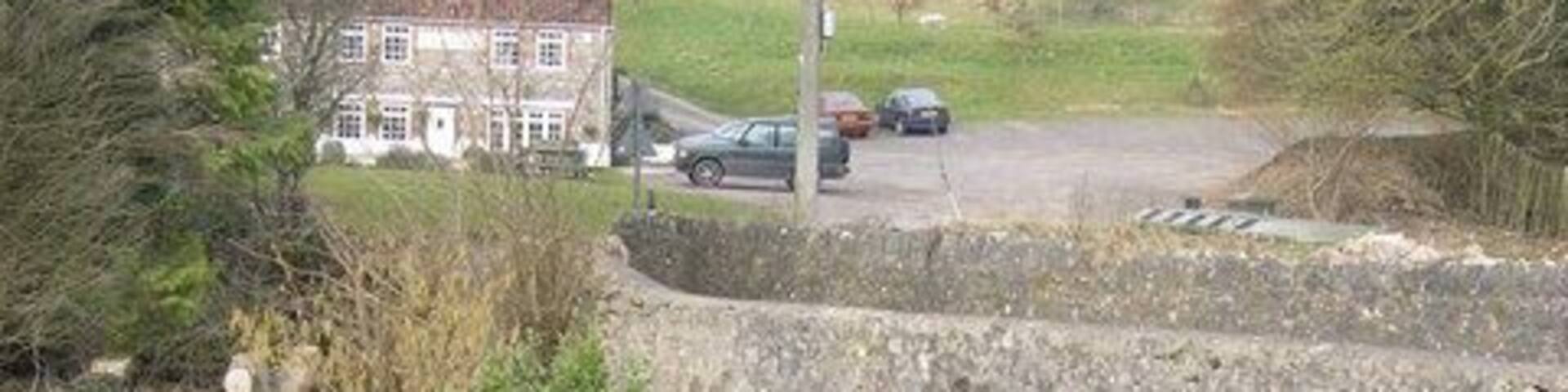 Vobster - looking towards the Vobster Inn. The pub "The Vobster" and its car park can be glimpsed in the background.