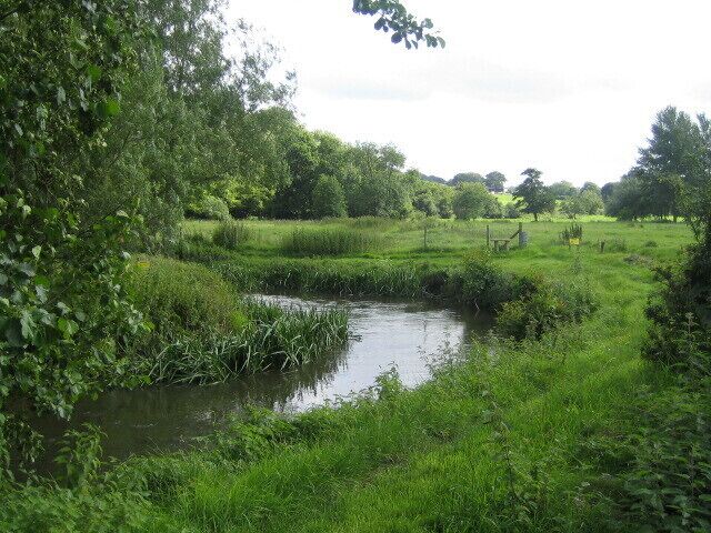 River Nadder near Teffont Evias The River Nadder is a chalk stream river with clear water and abundant fish and is the most significant of the tributaries of the Hampshire Avon. The river rises near Donhead St Mary east of Shaftesbury, and flows 32km to Wilton and through the park of Wilton House after where it joins the River Wylye. After a couple of miles the combined rivers join the River Avon close to Salisbury Cathedral. From Upper Chicksgrove - about 4km upstream - to Wilton the river is a Special Area of Conservation (SAC). This view looking upstream shows the river as it meanders across the 150m wide valley floor.