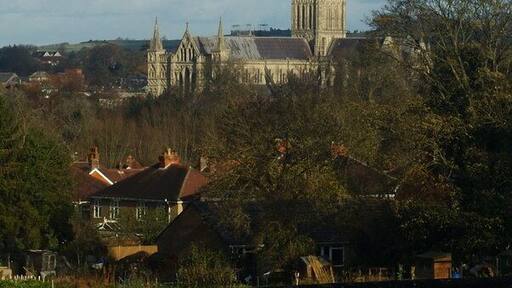 View From Harnham Hill, Salisbury Looking down across the houses, in the direction of Salisbury Cathedral. The rivers Avon and Nadder flow through the bottom of the valley, on this side of the cathedral, demonstrating that the cathedral is built on higher ground.