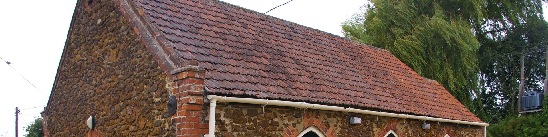 Brethren's Meeting Room, Blackborough End The sign reads: BRETHREN'S MEETING ROOM PLACE OF PUBLIC RELIGIOUS WORSHIP REGISTERED PURSUANT TO PLACES OF WORSHIP REGISTRATION ACT 1855 AND GENERAL RATE ACT 1967 INFORMATION ABOUT MEETINGS CAN BE OBTAINED BY CONTACTING THE TRUSTEES BY TELEPHONE ON 842466 OR 840075