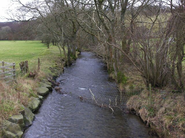Glasffrwd stream. Clear mountain water, here running tranquilly through flat fields west of Strata Florida, just before joining the Afon Teifi.