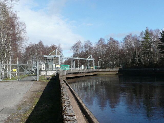 East end of Tummel Bridge aqueduct The water that has flowed swiftly along the aqueduct is here channelled into massive pipes for its descent to Tummel Bridge power station.