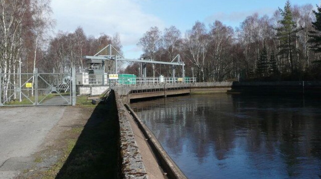 East end of Tummel Bridge aqueduct The water that has flowed swiftly along the aqueduct is here channelled into massive pipes for its descent to Tummel Bridge power station.