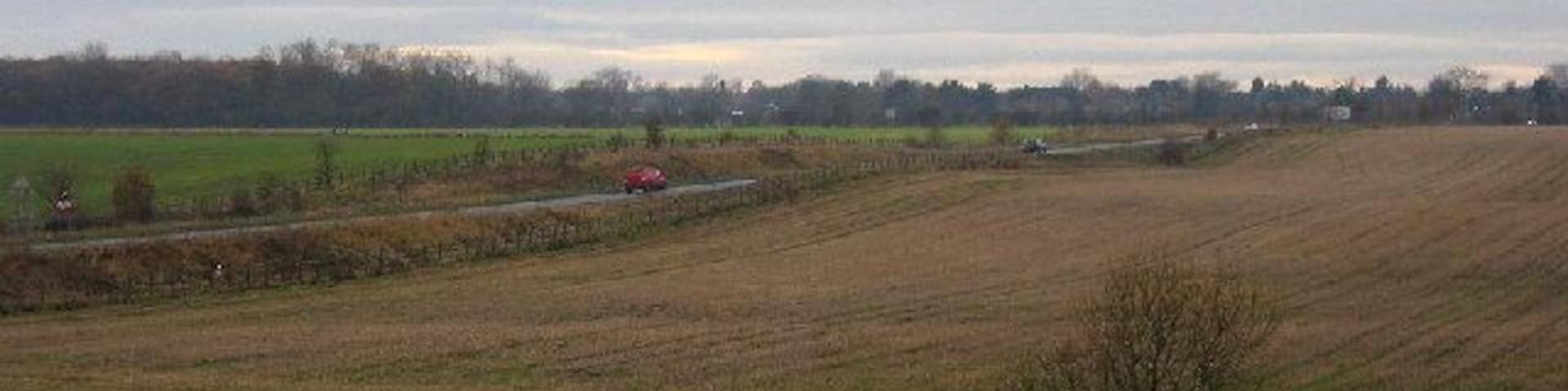The B6454 heading west towards Darras Hall. Officially known as the Callerton Lane Link Road it was built in 1990 to bypass Ponteland and link directly with the Darras Hall estate the outskirts of which can be seen in the distance.