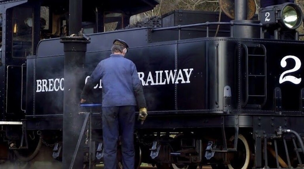Stop for water on the Brecon mountain railway. Old fashioned cowboy style steam engine.