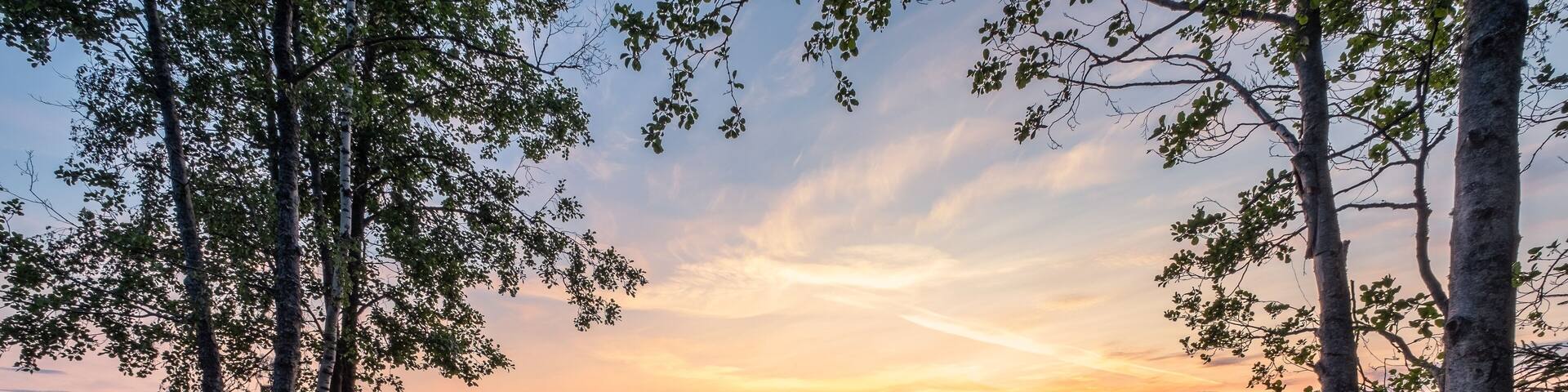 Idyllic landscape with beautiful sunset and tranquil mood at summer evening in Loppi, Finland