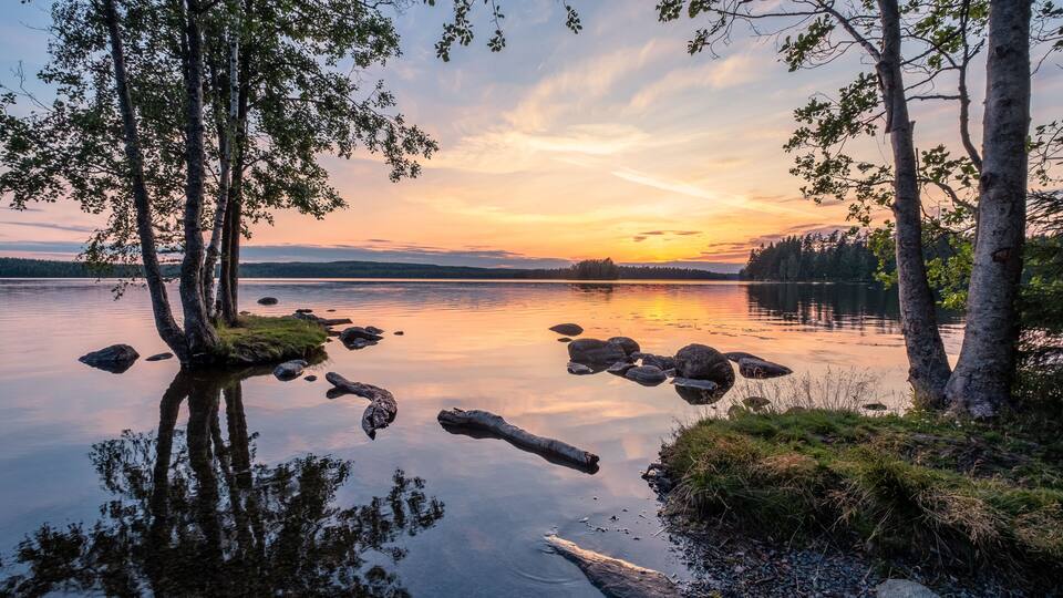 Idyllic landscape with beautiful sunset and tranquil mood at summer evening in Loppi, Finland