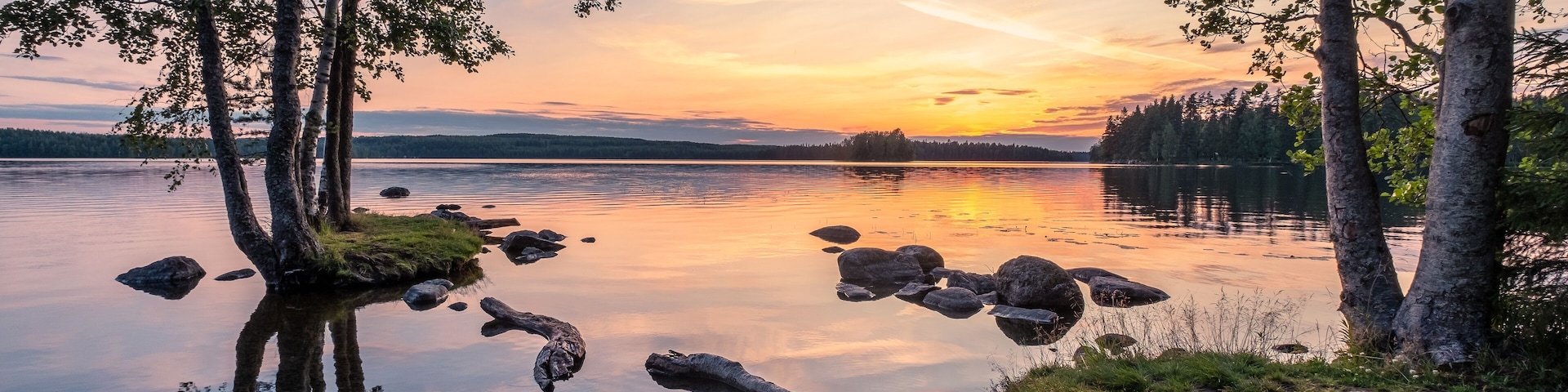 Idyllic landscape with beautiful sunset and tranquil mood at summer evening in Loppi, Finland