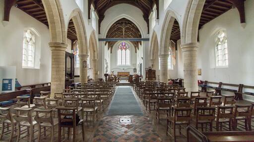 The church consists of a west tower, four-bay nave and aisles, chancel, and a north porch. The three stage tower was originally built in the early 15th century, but partly fell in the early 19th century and was probably reduced in height at that time. There is a battlemented parapet with crocketted pinnacles and gargoyles. It is decorated with Shields and panels of black flints. The nave has 13th century north and south arcades of four bays, with round piers and seat bases. There is a small perpendicular clerestory. There is a rood beam with a rood. The chancel has a finely decorated exterior east wall with checker patterns and three (empty) niches. There are also several mass dials. The chancel has a 15th century canopy over its piscina and sedilia. The north east end of the nave originally had a Chapel, There is a squint, a tomb slab from circa 1300 and a wall recess. In the centre of the chancel floor is a large brass to Sir William Calthorpe, died 1420. Burnham Thorpe is famous for being the birthplace of Lord Nelson, and he was baptised in the church. There are several references to him in the church. The lectern is made from a beam from HMS victory, given by Lords of the Admiralty in 1881. There is also a bust of Nelson and a Memorial for his father who was rector at the church and died in 1802. The church was renovated for the centenary of the Battle of Trafalgar in 1905. There is a Purbeck marble font dating from the 13th century with pointed arches on the faces. There is a small but fine organ which is currently the earliest survival by maker Samuel Street. Pic by Jenny.