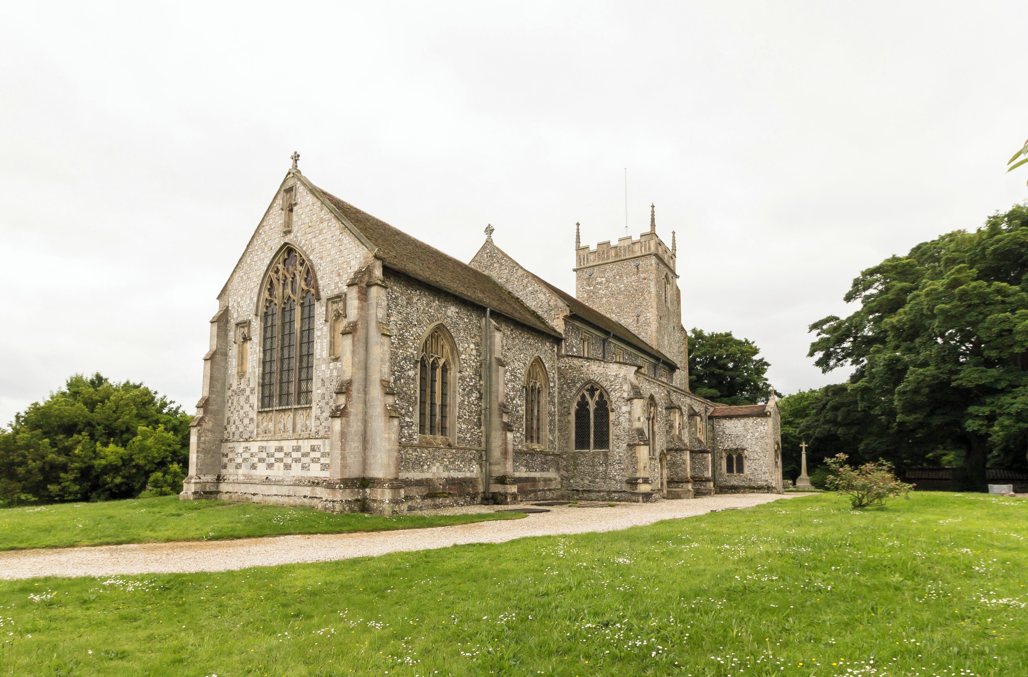 The church consists of a west tower, four-bay nave and aisles, chancel, and a north porch. The three stage tower was originally built in the early 15th century, but partly fell in the early 19th century and was probably reduced in height at that time. There is a battlemented parapet with crocketted pinnacles and gargoyles. It is decorated with Shields and panels of black flints. The nave has 13th century north and south arcades of four bays, with round piers and seat bases. There is a small perpendicular clerestory. There is a rood beam with a rood. The chancel has a finely decorated exterior east wall with checker patterns and three (empty) niches. There are also several mass dials. The chancel has a 15th century canopy over its piscina and sedilia. The north east end of the nave originally had a Chapel, There is a squint, a tomb slab from circa 1300 and a wall recess. In the centre of the chancel floor is a large brass to Sir William Calthorpe, died 1420. Burnham Thorpe is famous for being the birthplace of Lord Nelson, and he was baptised in the church. There are several references to him in the church. The lectern is made from a beam from HMS victory, given by Lords of the Admiralty in 1881. There is also a bust of Nelson and a Memorial for his father who was rector at the church and died in 1802. The church was renovated for the centenary of the Battle of Trafalgar in 1905. There is a Purbeck marble font dating from the 13th century with pointed arches on the faces. There is a small but fine organ which is currently the earliest survival by maker Samuel Street. Pic by Jenny.