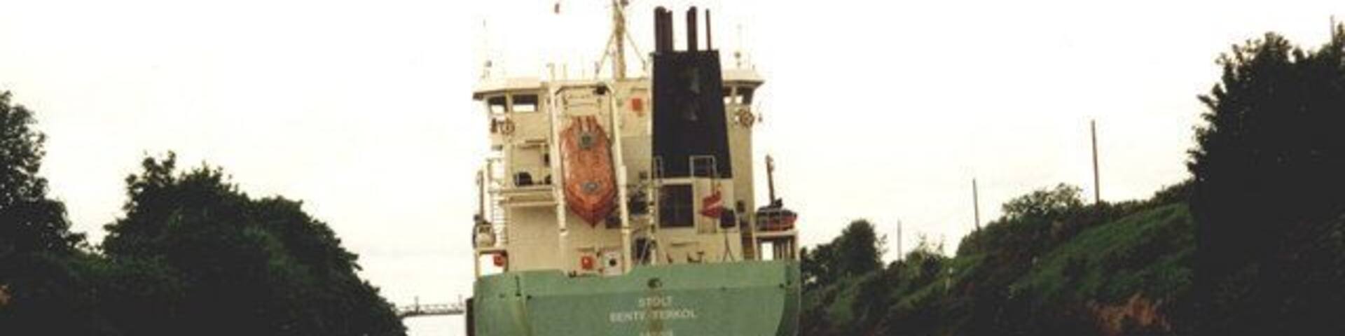 Little & large on the Manchester Ship Canal Stragglers from the flotilla organised by the Inland Waterways Association to mark the Centenary of the Ship Canal were suddenly presented with having to squeeze past an ocean-going freighter as they approached Latchford Locks.